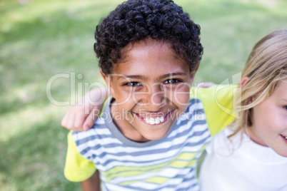 Happy boy standing in park Happy boy standing in park