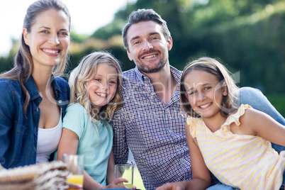 Portrait of happy family having a picnic