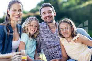 Portrait of happy family having a picnic