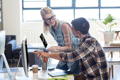 Graphic designer interacting at their desk