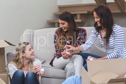 Friends interacting with each other in their new house