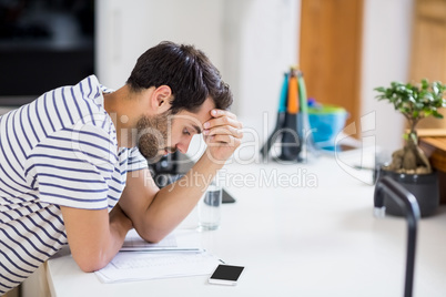 Worried man looking at bills