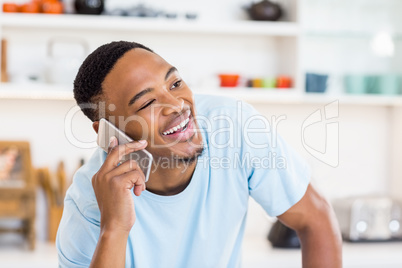 Happy man talking on mobile phone