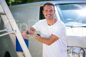 Painter with stepladder and bucket