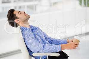 Businessman relaxing on chair