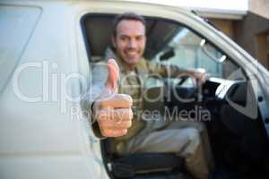 Delivery man sitting in his van