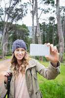 Smiling woman taking selfies