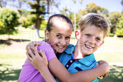 Siblings embracing each other