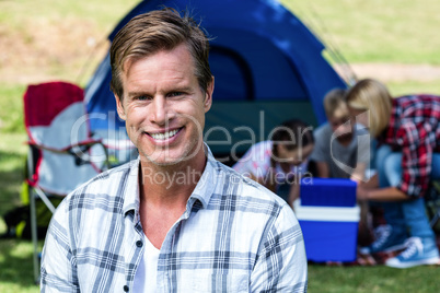 Portrait of a happy man outside the tent