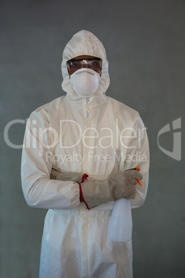 Pest control man standing with spray bottle
