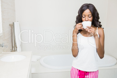 Young woman drinking coffee