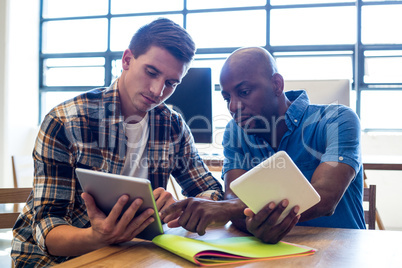 Colleagues interact using digital tablet