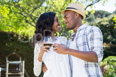 Young couple toasting glasses of wine
