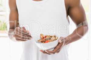 Close-up of man having breakfast cereals