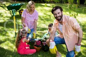 Father against family during gardening