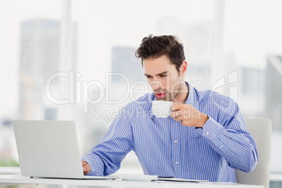 Businessman having a cup of coffee