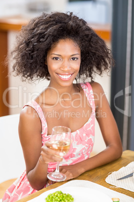 Young woman holding a glass of wine