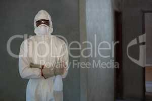 Pest control man standing with spray bottle