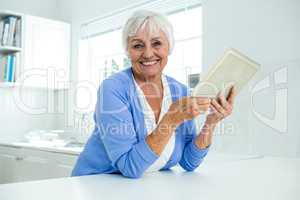 Portrait of senior woman using tablet pc