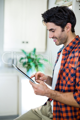 Smiling man using digital tablet Smiling man using digital tablet