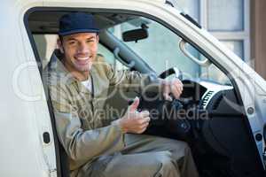 Delivery man sitting in his van