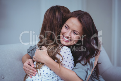 Two female friends embracing each other