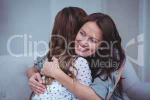 Two female friends embracing each other