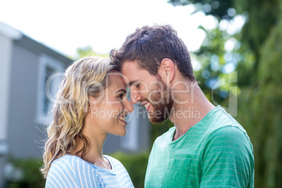 Couple touching head in yard