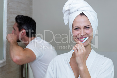 Couple brushing their teeth in the bathroom