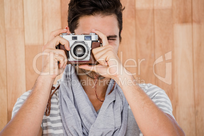 Handsome man taking a photograph