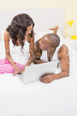 Young couple using a laptop