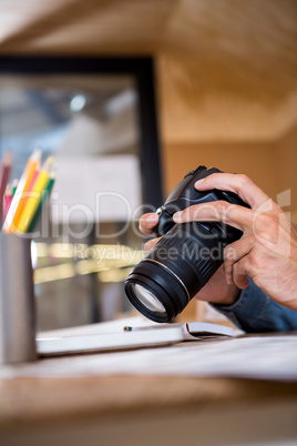 Man checking photo in camera