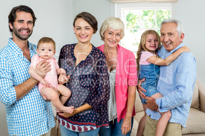 Cheerful multi-generation family in living room