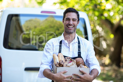 Portrait of cheerful delivery person