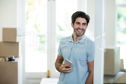 Young man holding mobile phone