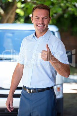 Handyman standing near his delivery van