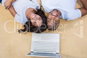 Young couple relaxing on the floor