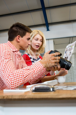 Colleagues checking a photos in camera