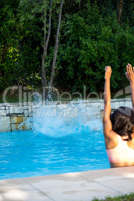 Woman about to swim in swimming pool