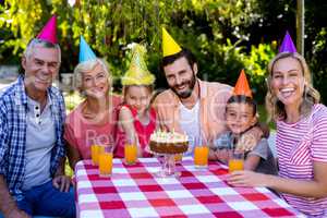 Multi-generation family enjoying at birthday in yard