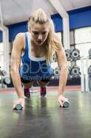 Determined woman doing push ups