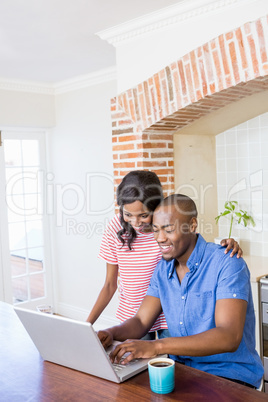 Young couple using laptop