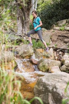 Fit smiling woman hiking