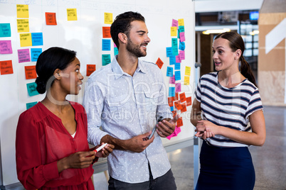 Colleagues discussing in the office