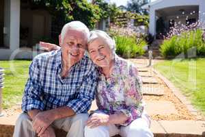 Senior couple embracing in the garden