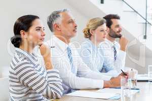 Business colleagues sitting together in meeting