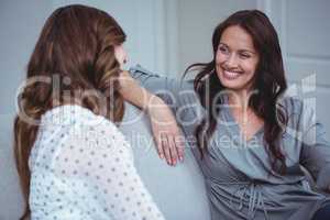 Two beautiful woman interacting with each other