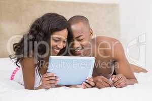 Young couple using a digital tablet
