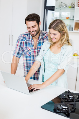 Young couple using laptop