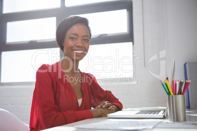 Portrait of woman with laptop